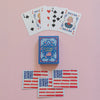 Playing cards with decorative designs on a pink background
