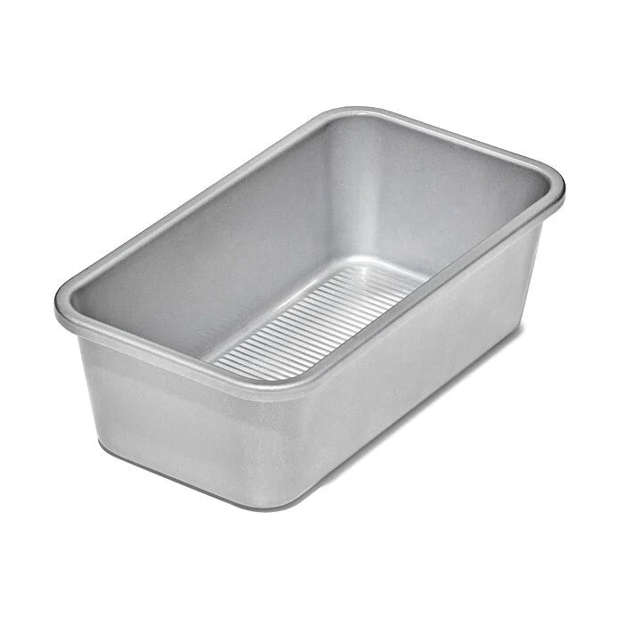 Metal loaf pan on a white background