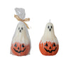 Two Halloween-themed candles, one in a clear bag with a bow, on a white background.