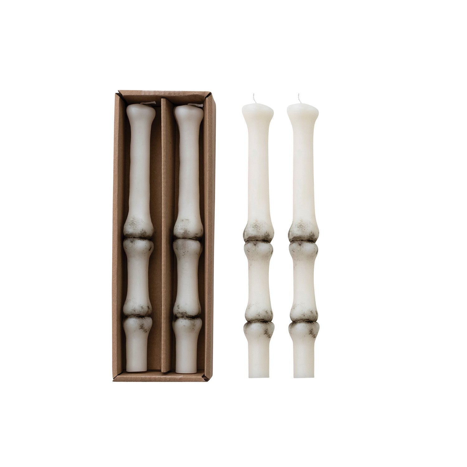 Set of white candlesticks with a cardboard box on a white background