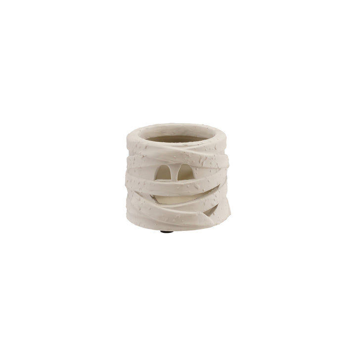 White ceramic vase with mummy face and wrapping on a white background