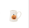 White halloween mug with pumpkin design on a white background