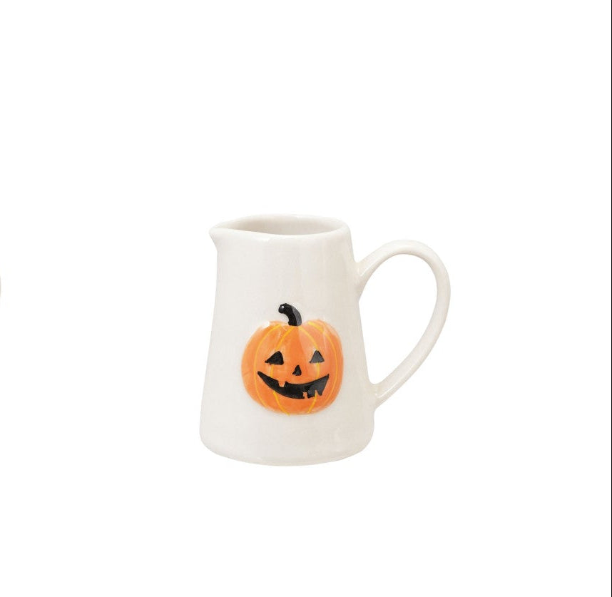White halloween mug with pumpkin design on a white background