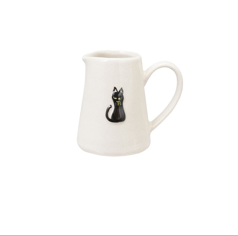 White halloween mug with black cat design on a white background