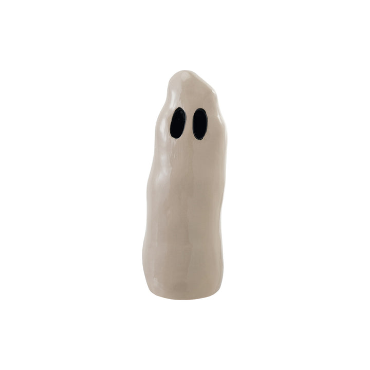 Ghost-shaped decoration with black eyes on a white background