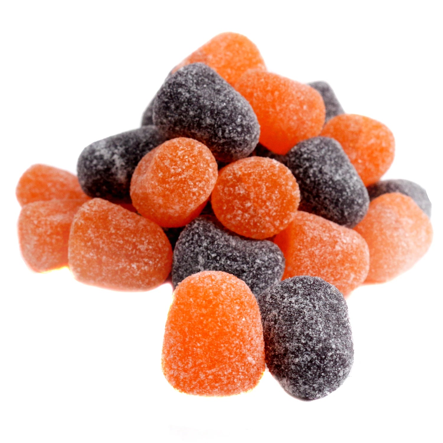 Pile of orange and black gummy candies on a white background