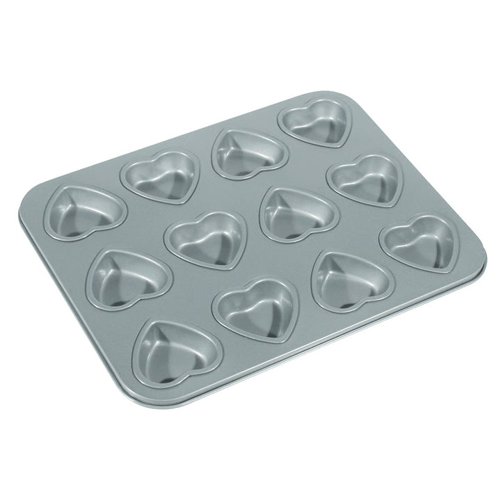 Metal heart-shaped muffin tin on a white background