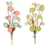 Decorative branches with colorful eggs on a white background