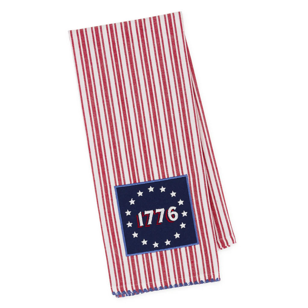 Red and white striped towel with a blue patch featuring the number 1776. Towel is featured on a white background