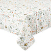 Floral and bee patterned tablecloth on a white background