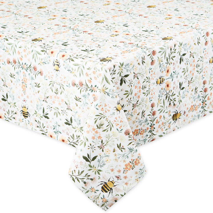 Floral and bee patterned tablecloth on a white background