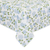 Floral patterned tablecloth with blue flowers and green leaves on a white background