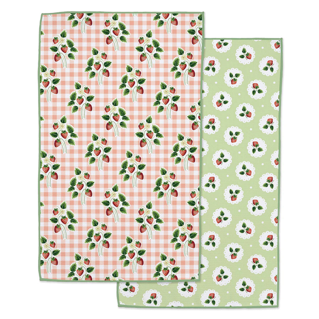 Kitchen towel with strawberry patterns on each side on a white background