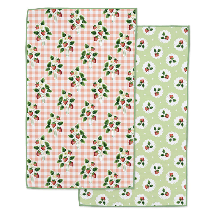 Kitchen towel with strawberry patterns on each side on a white background