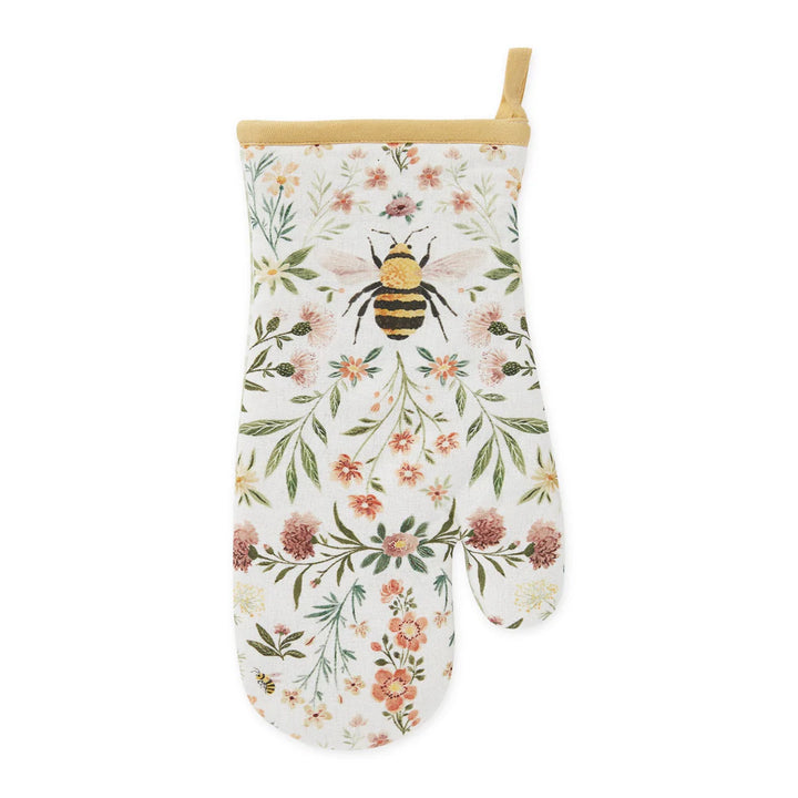 Oven mitt with floral and bee design on a white background