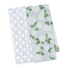 Two patterned towels with blue and white designs on a white background