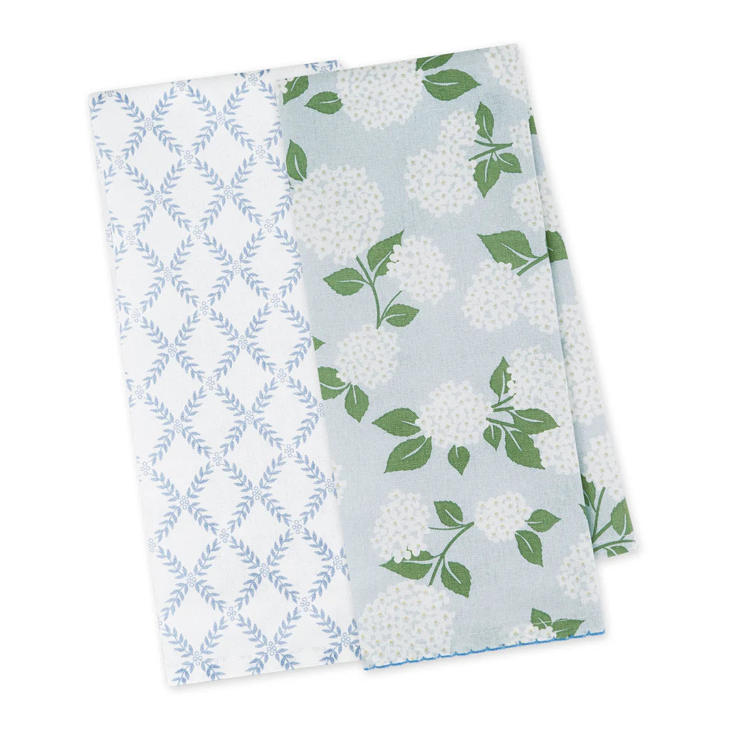 Two patterned towels with blue and white designs on a white background