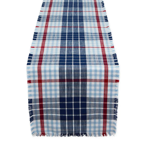 Plaid table runner with red, blue, and white pattern on a white background