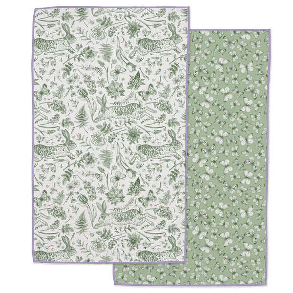 Two green patterned towels on a white background
