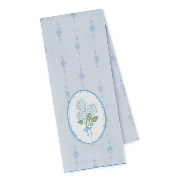 Light blue towel with floral design on a white background
