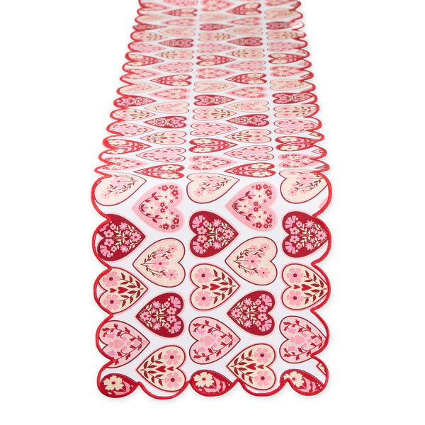Decorative table runner with heart patterns on a white background