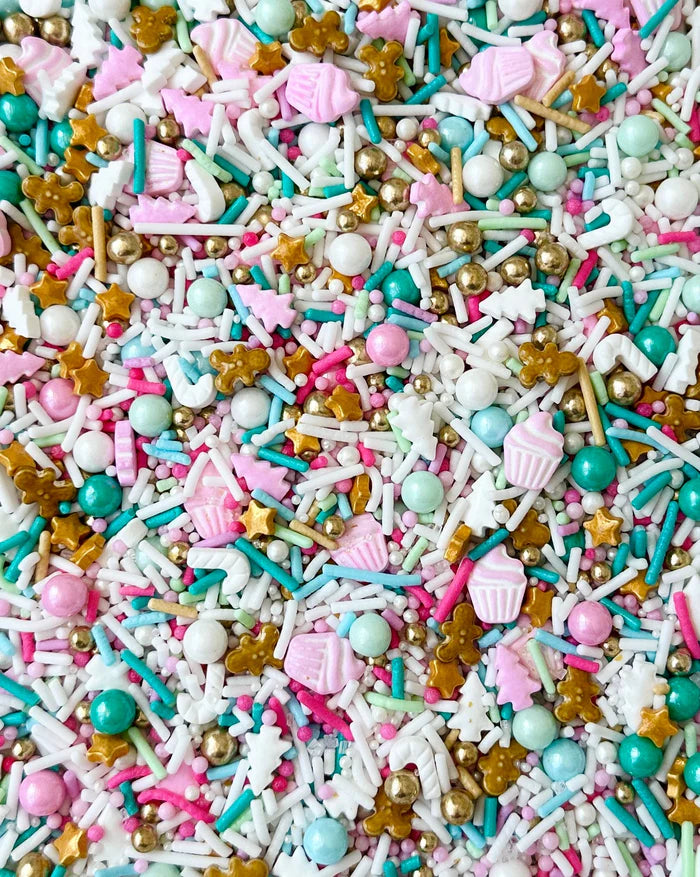 Colorful assortment of sprinkles with various shapes and sizes on a white background