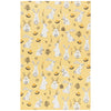 Patterned fabric with white rabbits and plants on a yellow background