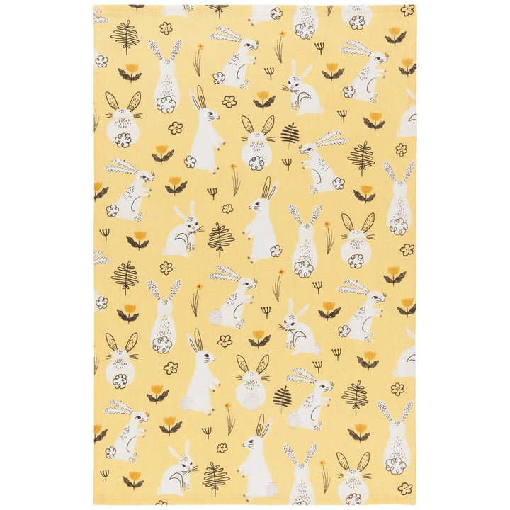 Patterned fabric with white rabbits and plants on a yellow background
