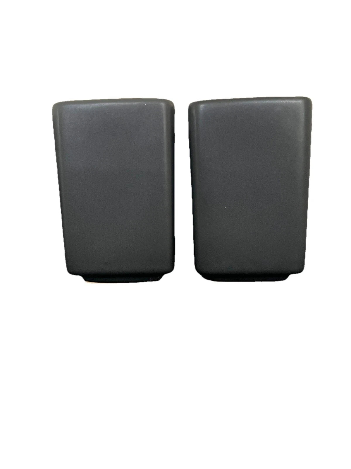 Matte black salt and pepper shakers on a white background