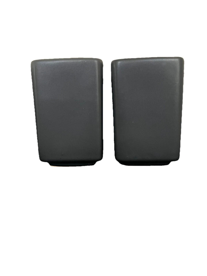 Matte black salt and pepper shakers on a white background