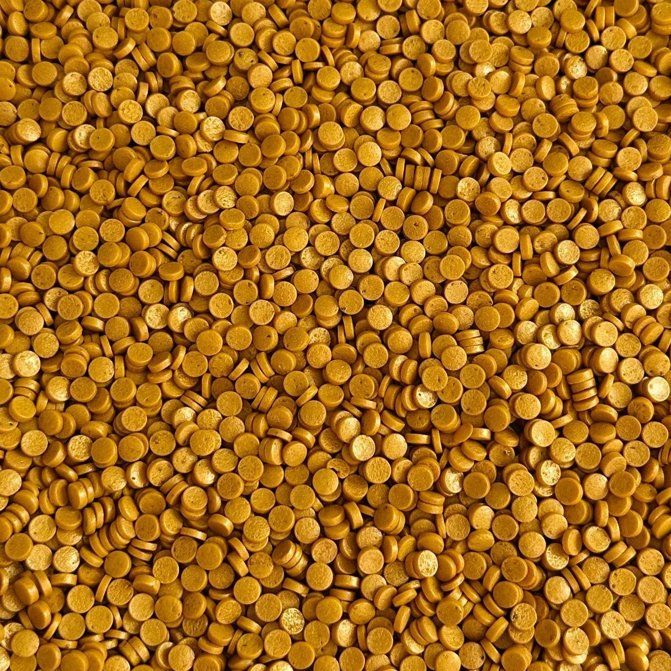 Close-up of gold round sprinkles