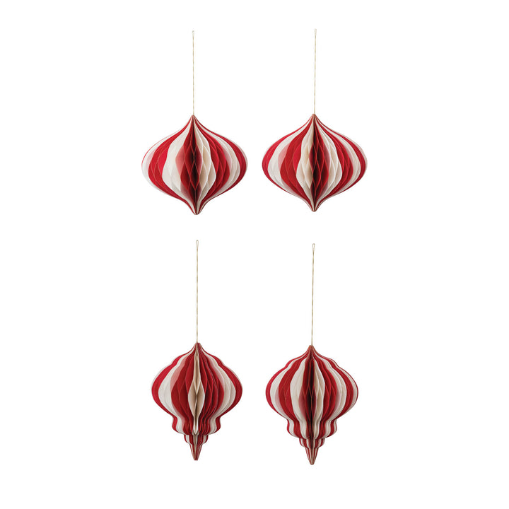 Four red and white striped paper ornaments hanging against a white background