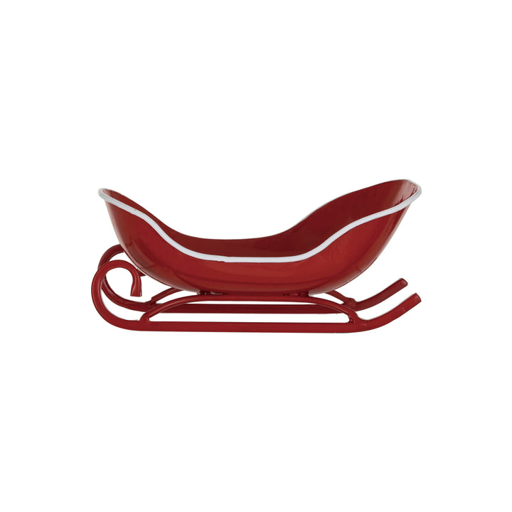 Red sled with white trim on a white background