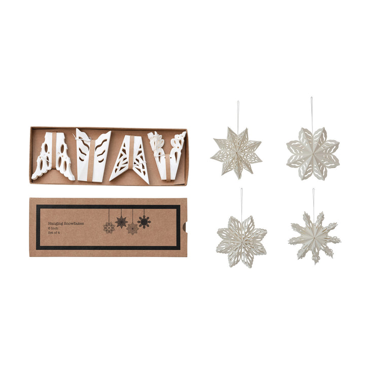 Set of hanging decorative snowflake ornaments with packaging on a white background