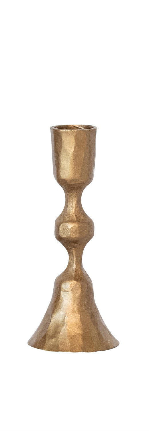 Small gold candle holder on a white background