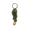 Decorative door hanger with green leaves and a gold bell on a white background