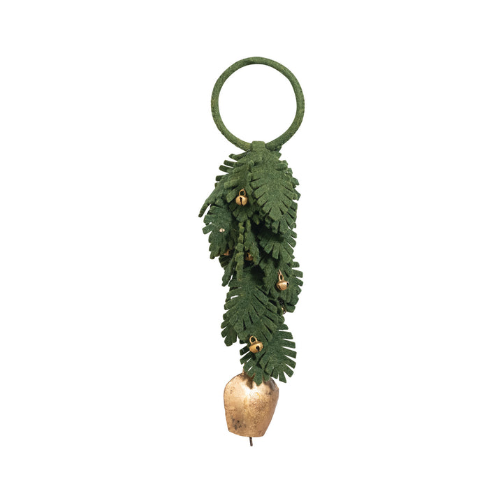 Decorative door hanger with green leaves and a gold bell on a white background