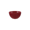 Red stoneware bowl on a white background