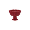 Red stoneware footed bowl on a white background