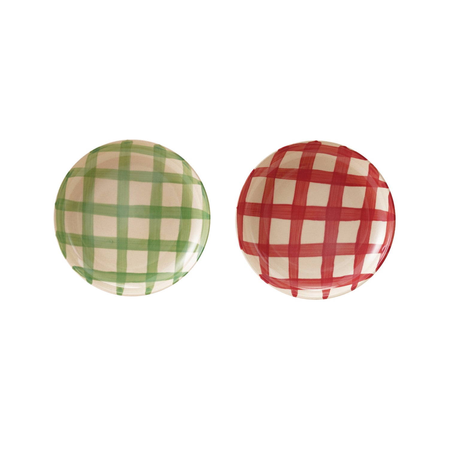 Two round plates with green and red checkered patterns on a white background