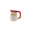 Santa Claus-shaped pitcher with a red handle on a white background