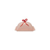 Pink butter dish with a red bow on a white background