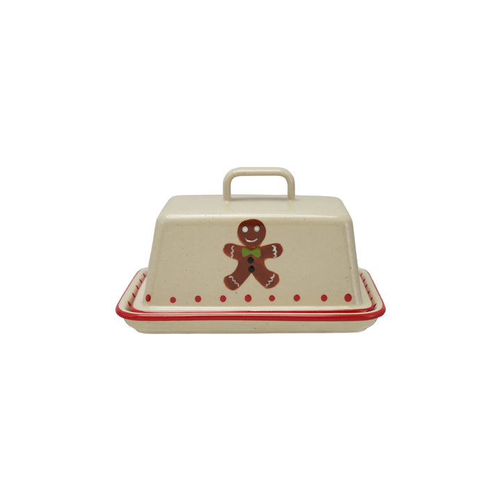 Stoneware butter dish with gingerbread man design on a white background