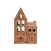 Decorative ceramic gingerbread house with intricate designs on a white background