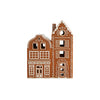 Decorative ceramic gingerbread house with intricate details on a white background