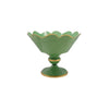 Green decorative bowl with gold scalloped edge on a white background