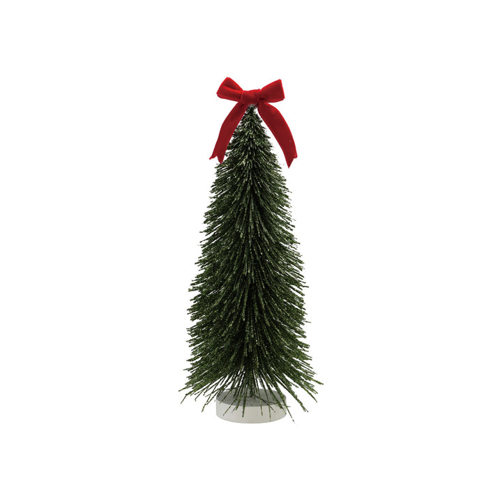 Small decorative Christmas tree with a red bow on a white background