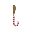 Spreader with candy cane handle on a white background