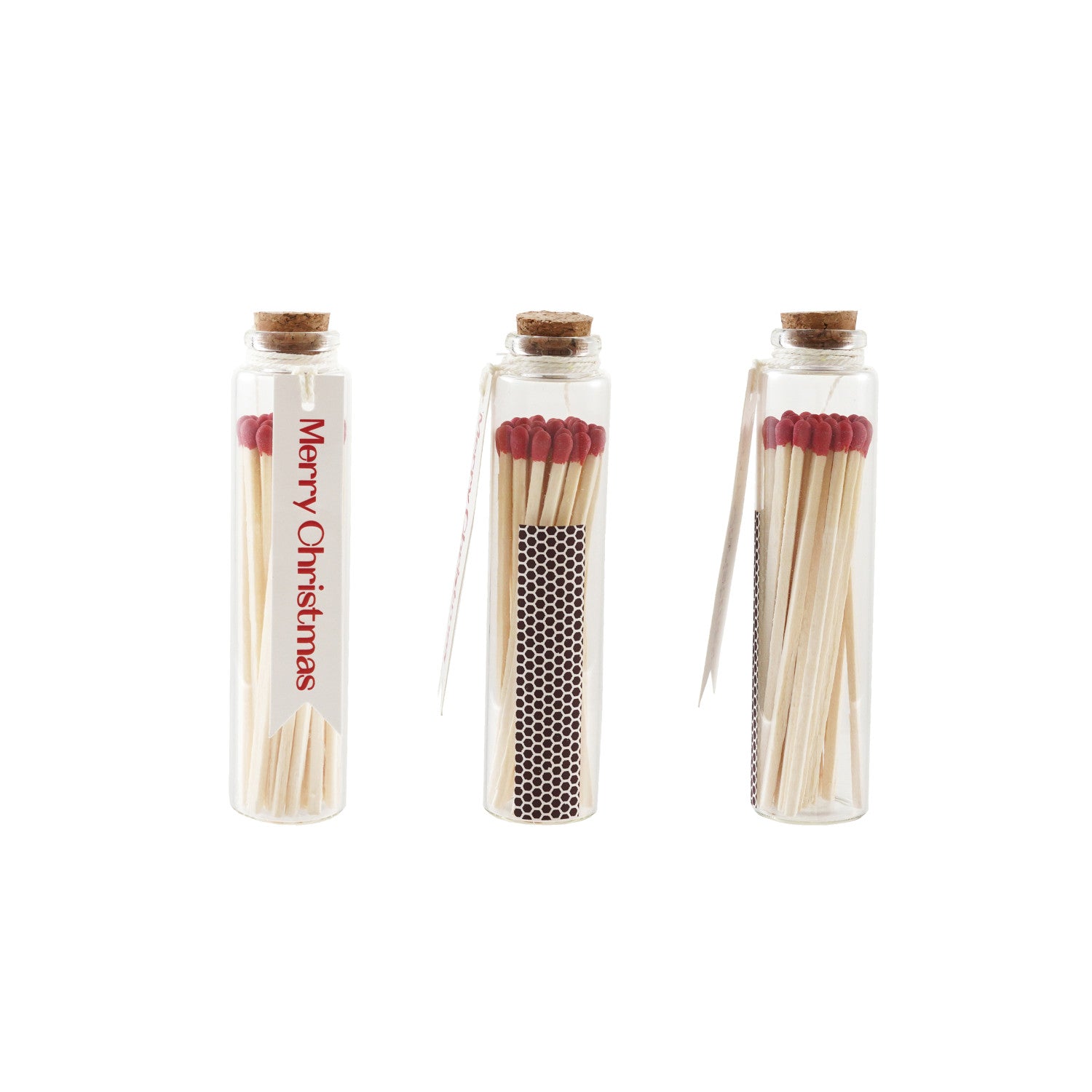 Three glass containers with matches, labeled Merry Christmas, on a white background.