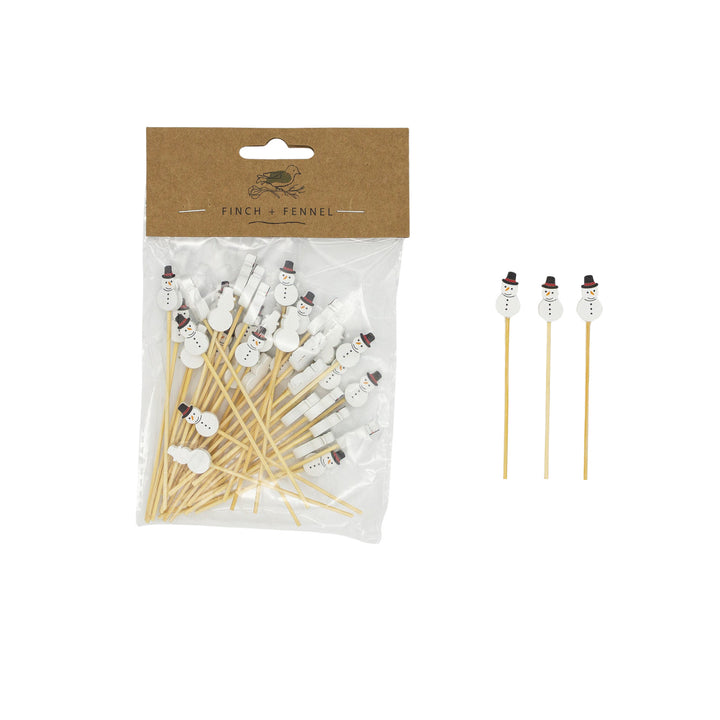 Packaged wooden skewers with snowman toppers on a white background